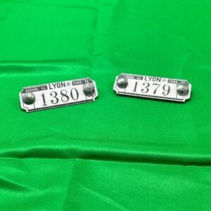 Vintage industrial metal locker number tags or plates from Lyon Metal Products